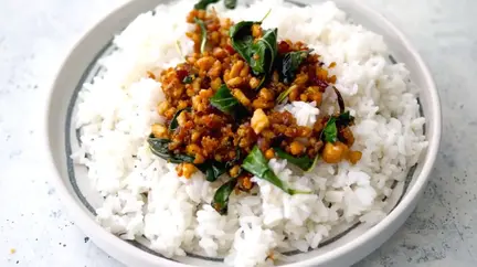 Flavorful Thai basil tofu bowl with fresh tofu, aromatic basil, and vibrant vegetables in a savory sauce.